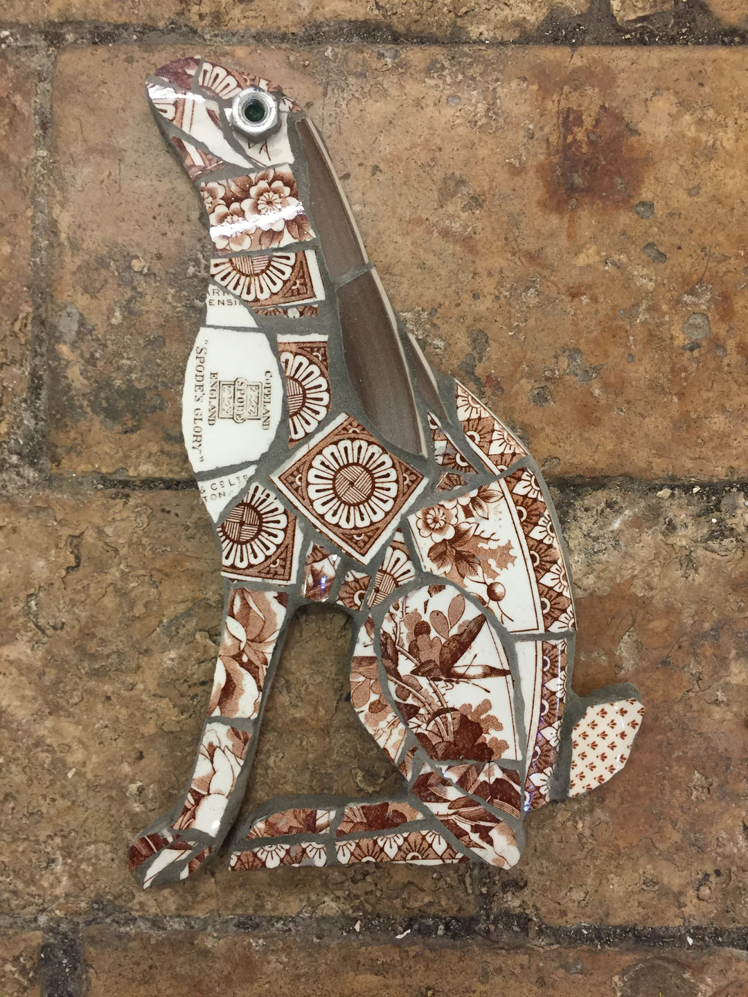 mosaic hare made with broken crockery and glass