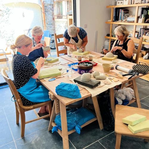 Women around a table at a craft workshop